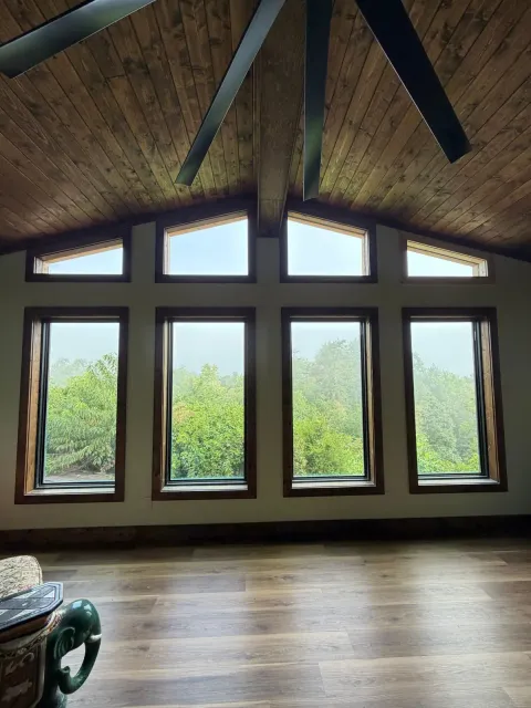 Living Room Addition: Vaulted Gable & Stone Fireplace — view 1