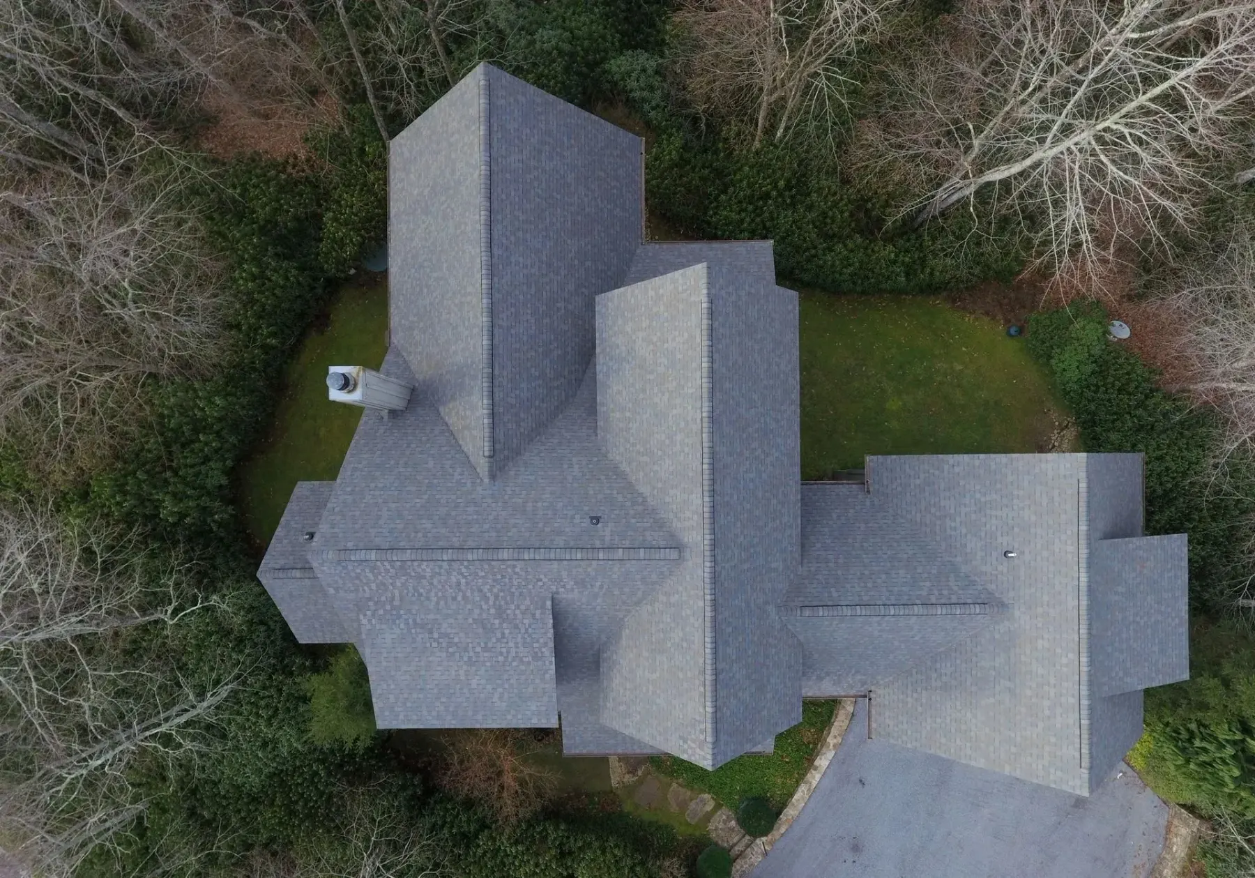 Slate gray dimensional shingle roof with multiple intersections in Franklin, North Carolina