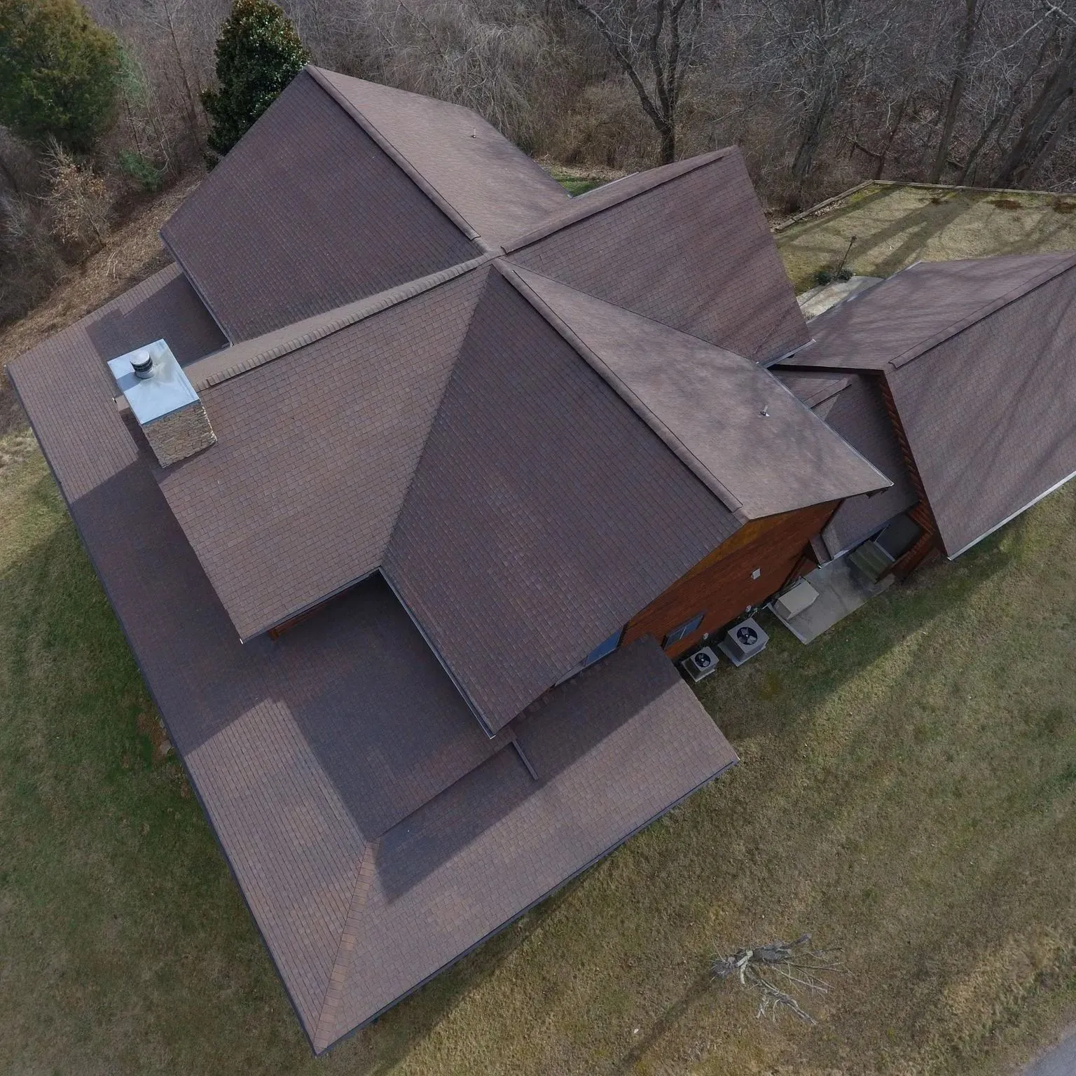 Dimensional shingle roof replacement with ridge ventilation in Bryson City, North Carolina